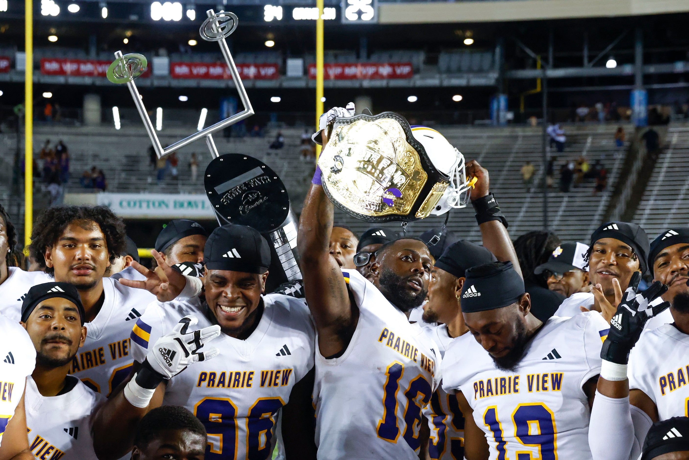 Prairie View A&M players celebrate after winning the State Fair Classic against Grambling...