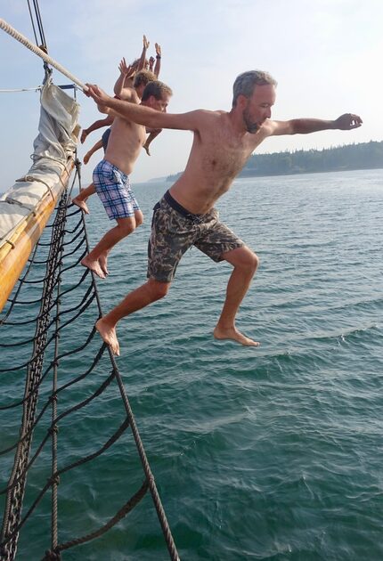 Passengers Brad Smith (foreground) and John Gauger join others in leaping from the bow.