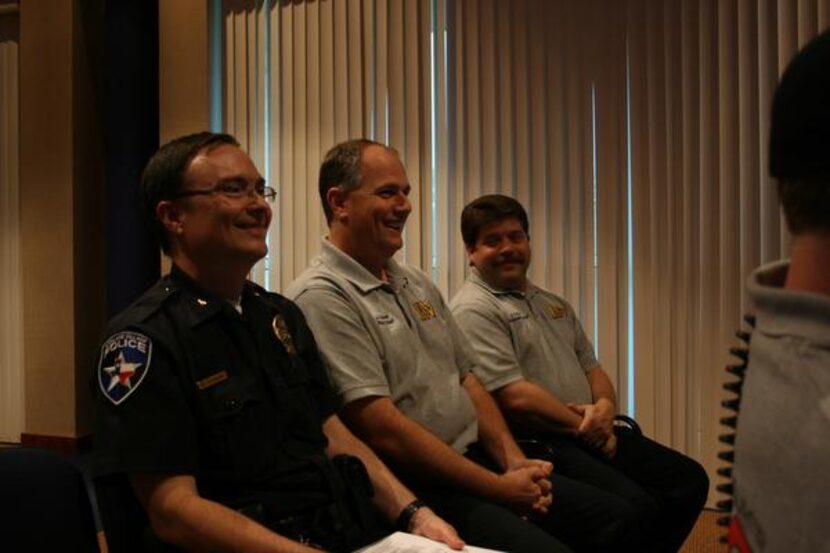 
Highland Village Fire Chief John Glover (center) shares a laugh with Assistant Police Chief...