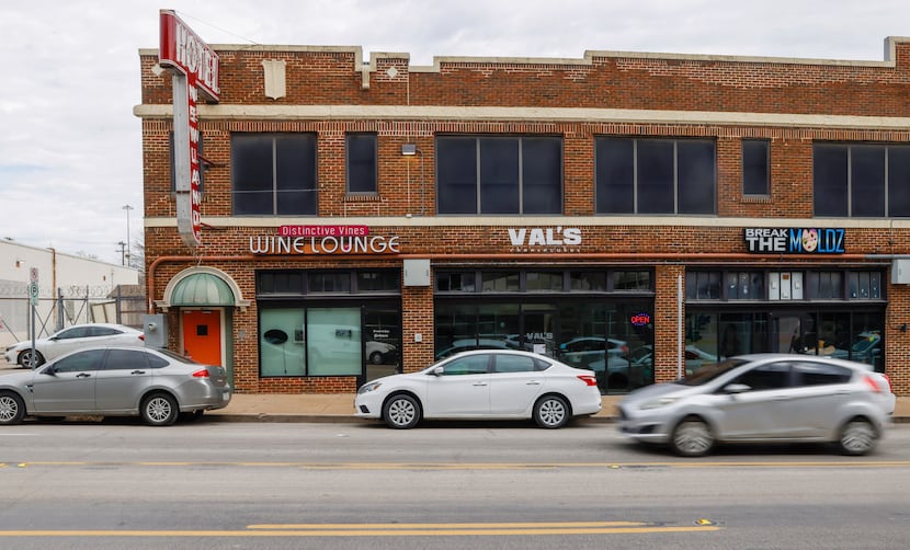 Traffic moves along South Akard Street in front of the newest Val's Cheesecakes location in...