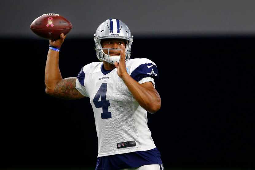 Dallas Cowboys quarterback Dak Prescott (4) throws a pass during practice drills at The Star...