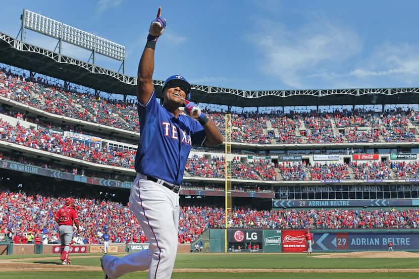 Texas Rangers third baseman Adrian Beltre (29) gestures to the crowd after hitting a two-run...