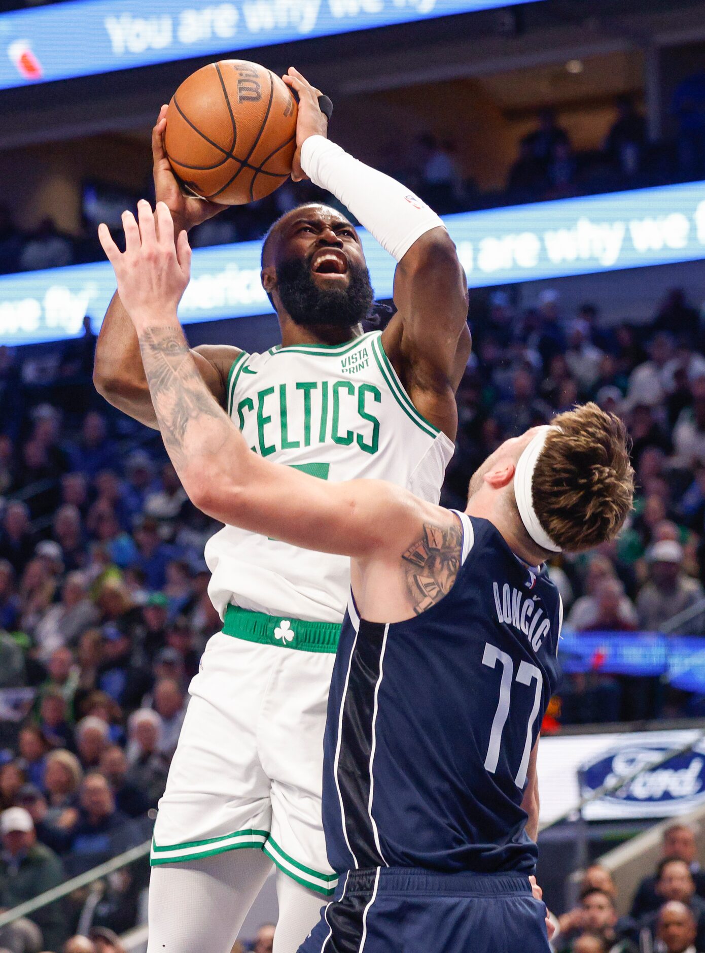 Boston Celtics guard Jaylen Brown (7) drives to the basket against Dallas Mavericks guard...