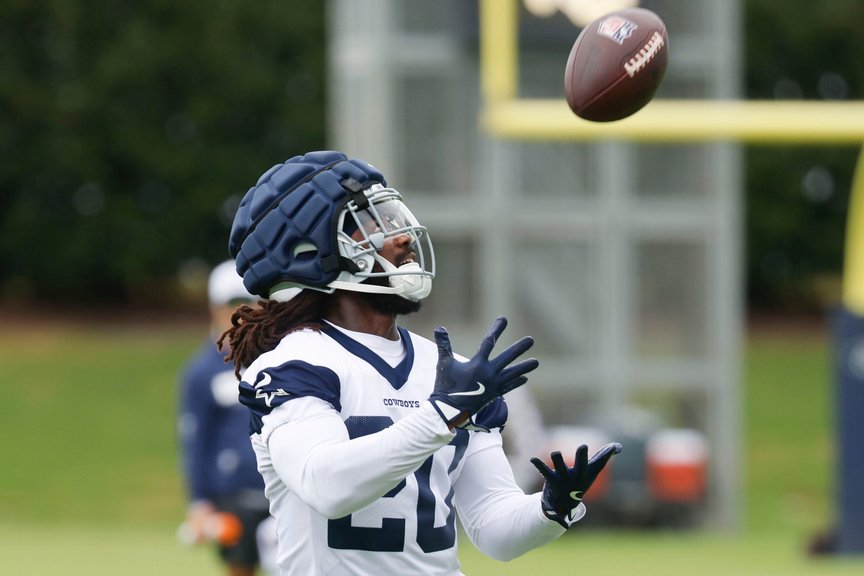 Dallas Cowboys wide receiver Dalvin Cook reaches to receive a throw during a team practice,...