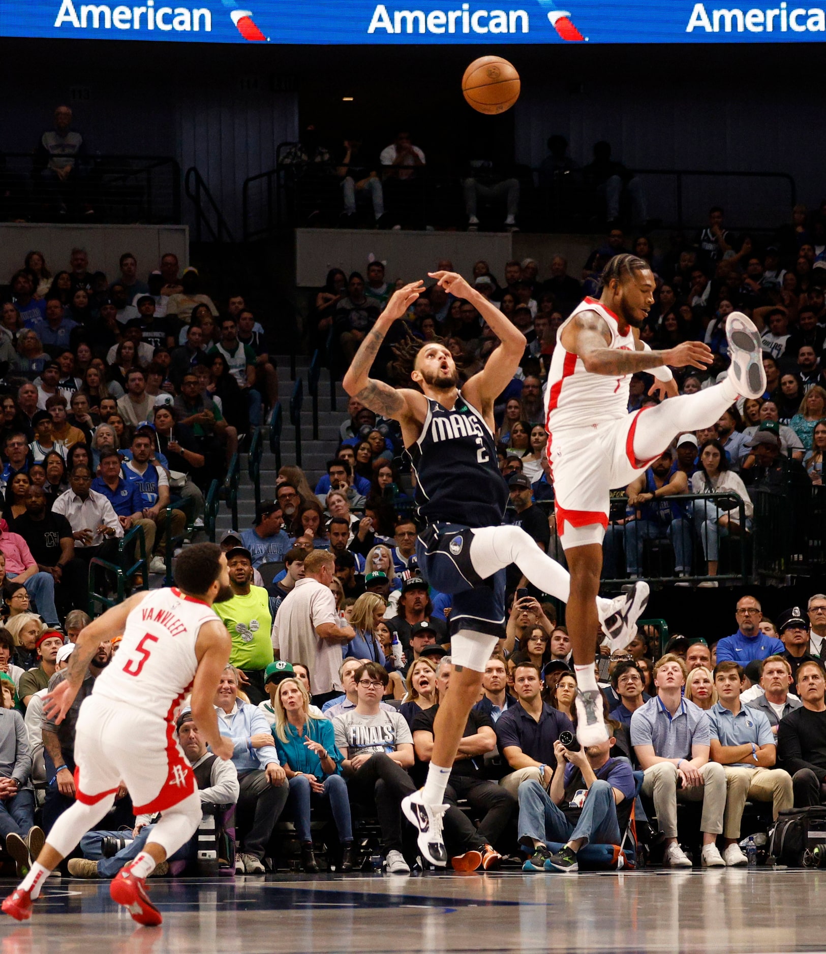 Dallas Mavericks center Dereck Lively II (2) and Houston Rockets forward Cam Whitmore (7)...