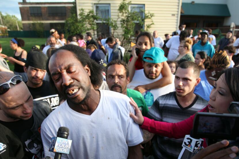 Neighbor Charles Ramsey speaks to media near the home on the 2200 block of Seymour Avenue,...