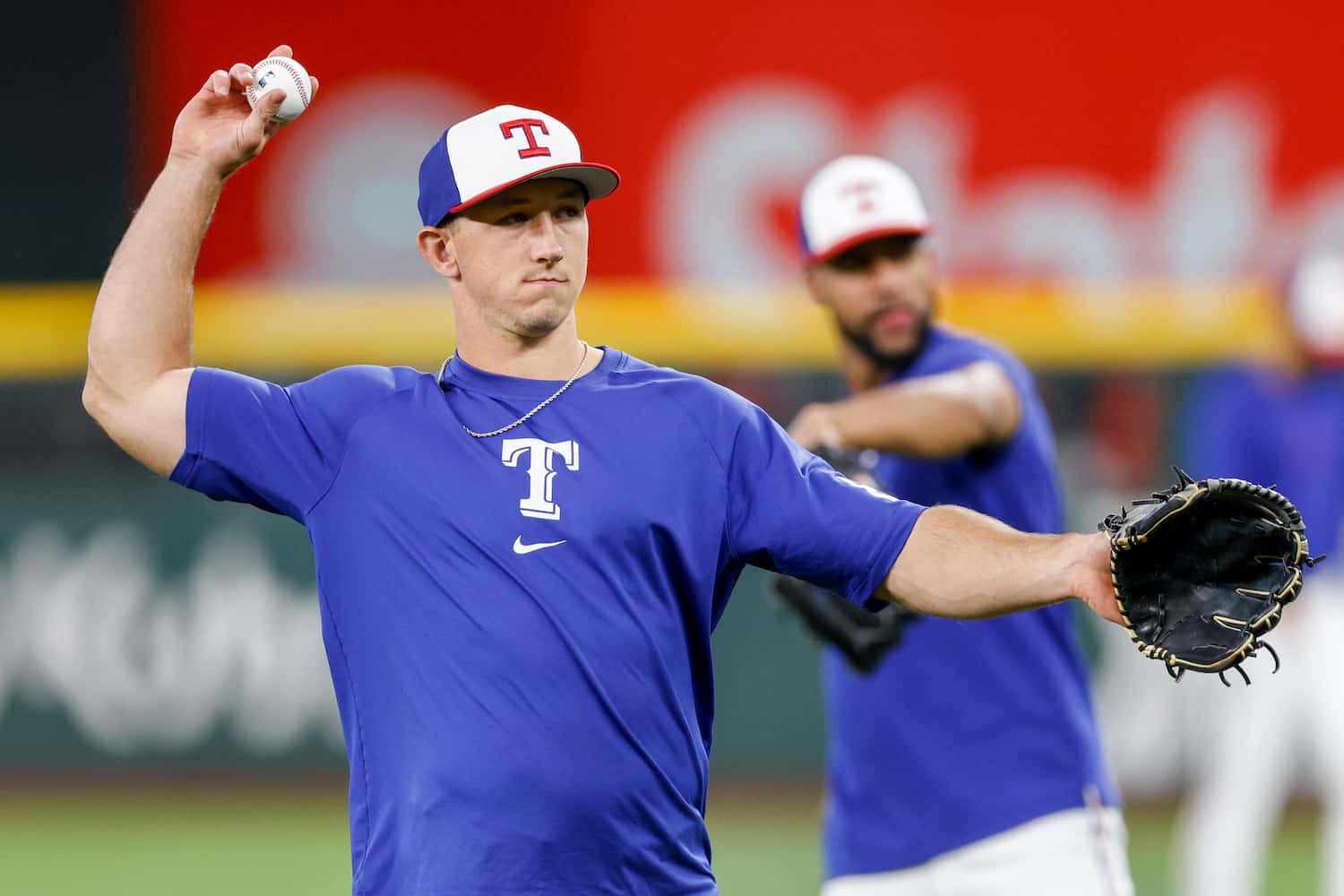Texas Rangers outfielder Wyatt Langford throws during a practice at Globe Life Field,...