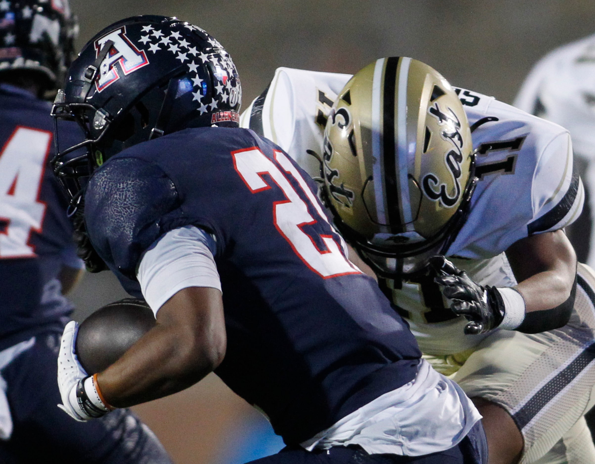 Allen running back Jaden Hambric (21), left, takes a handoff in the Eagles backfield as...