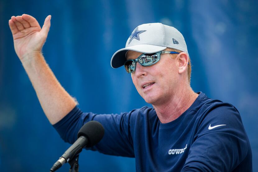 Dallas Cowboys head coach Jason Garrett speaks to reporters before an afternoon practice at...