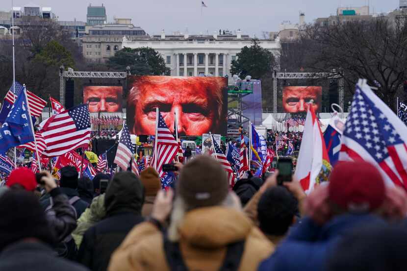 FILE - Supporters of President Donald Trump supporters attend a rally near the White House...