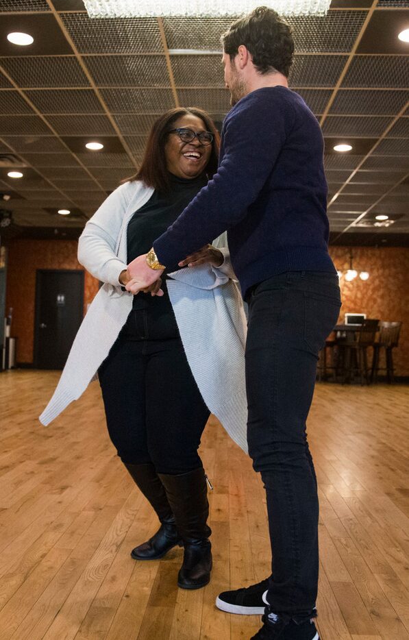 Dancer Valentin Chmerkovskiy dances with Dawn Burkes, a reporter at The Dallas Morning News,...