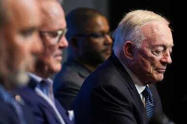 Dallas Cowboys owner and general manager Jerry Jones listens to a question from reporters...