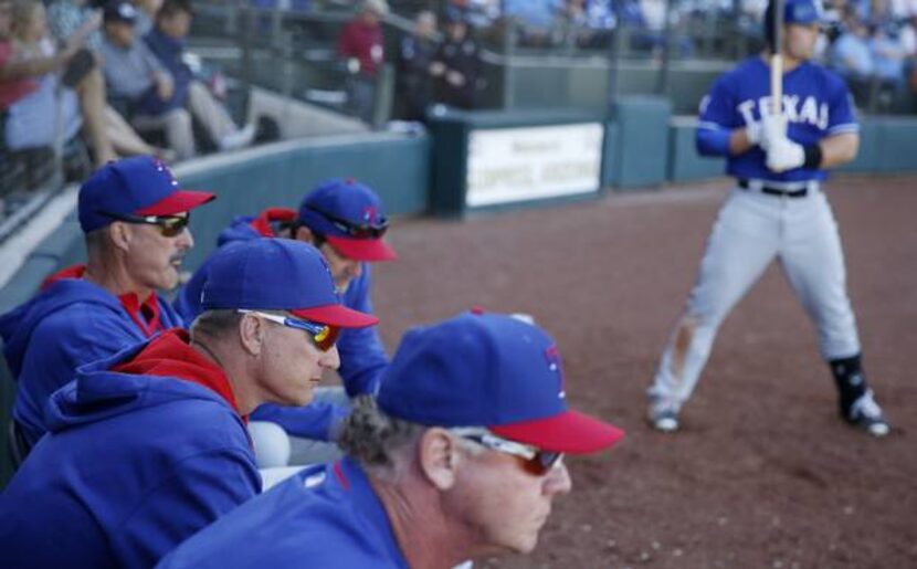 Texas Rangers manager Jeff Banister watches the action on the field late in the game during...