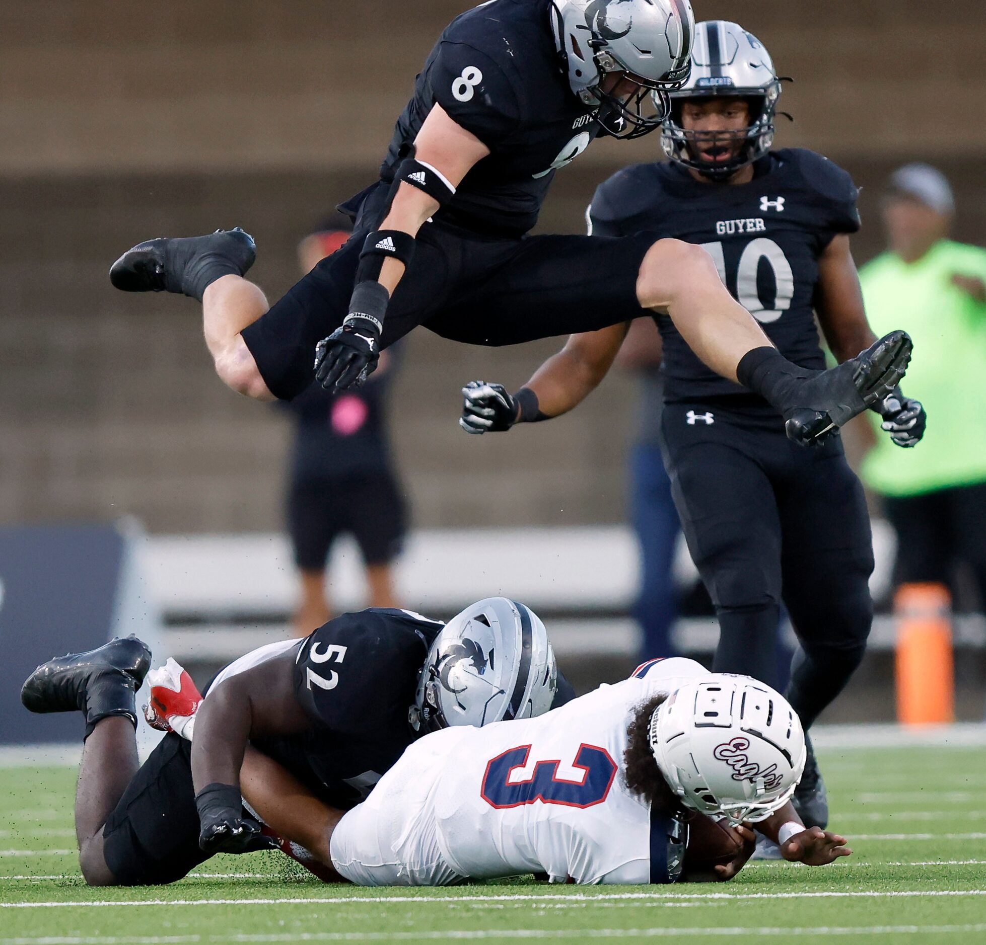 Denton Guyer Pelumi Olanipekun (52) sacks Allen quarterback Mike Hawkins (3) as Blade Carver...