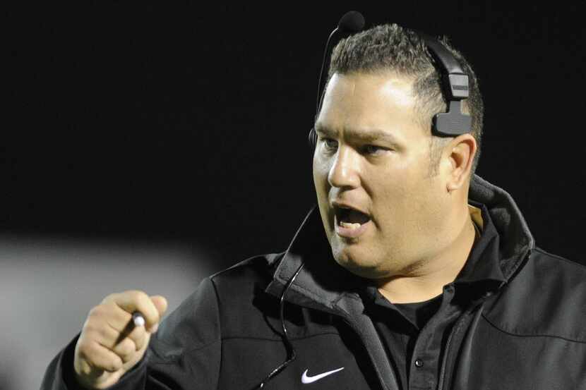 Irving head coach Aaron De La Torre in the first half during a Class 5A, Division 1 high...