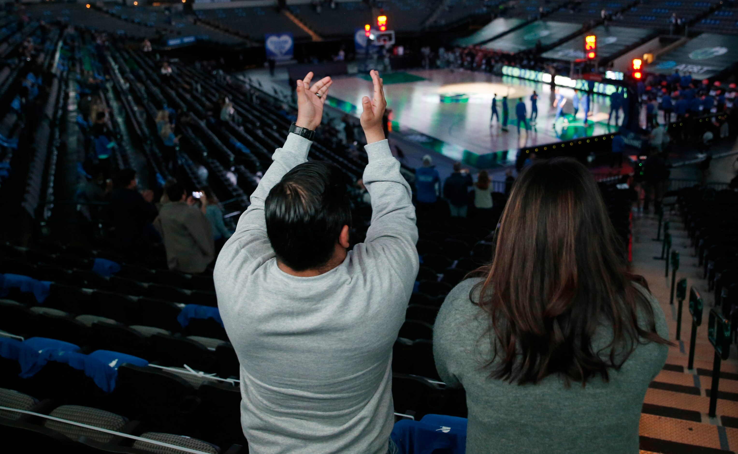 Diego and wife Christi Contreras cheer on the Dallas Mavericks as they are introduced before...