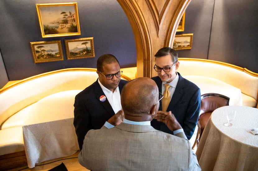 Mayoral candidates Eric Johnson and Scott Griggs chats with a member of the Dallas Citizen...