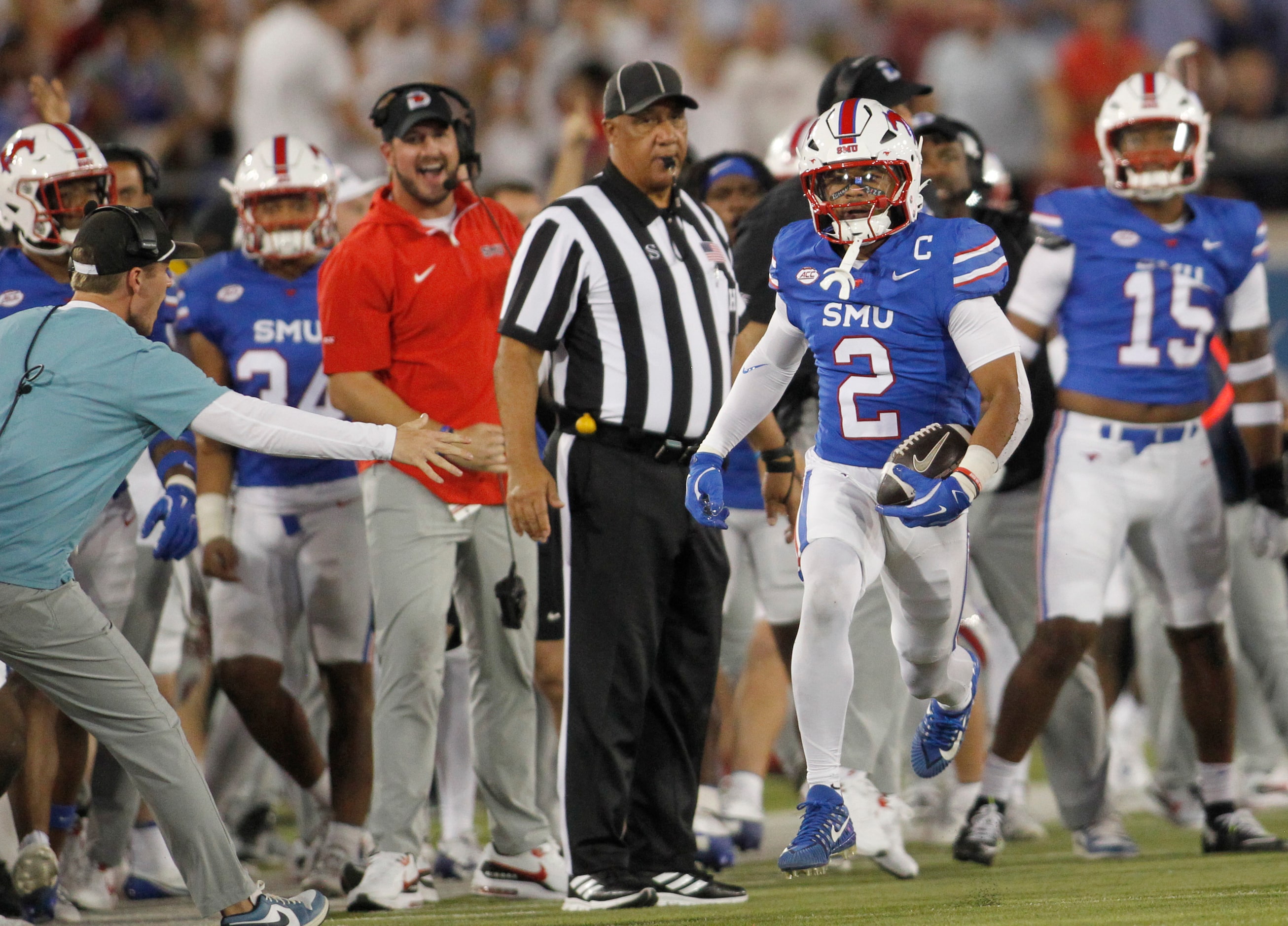 Southern Methodist University safety Jonathan McGill (2) ignites the Mustangs bench after...