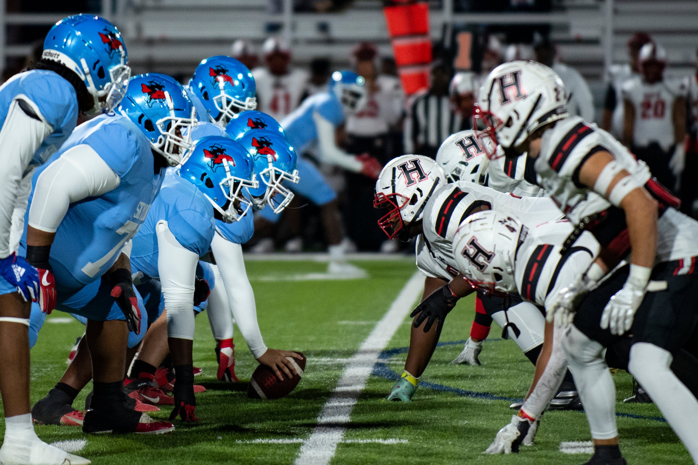 The Skyline offensive line prepares to snap the ball against the Heath defensive line during...