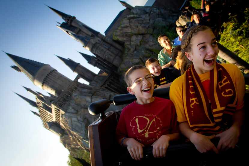 On Flight of the Hippogriff at the Wizarding World of Harry Potter, guests climb into a...