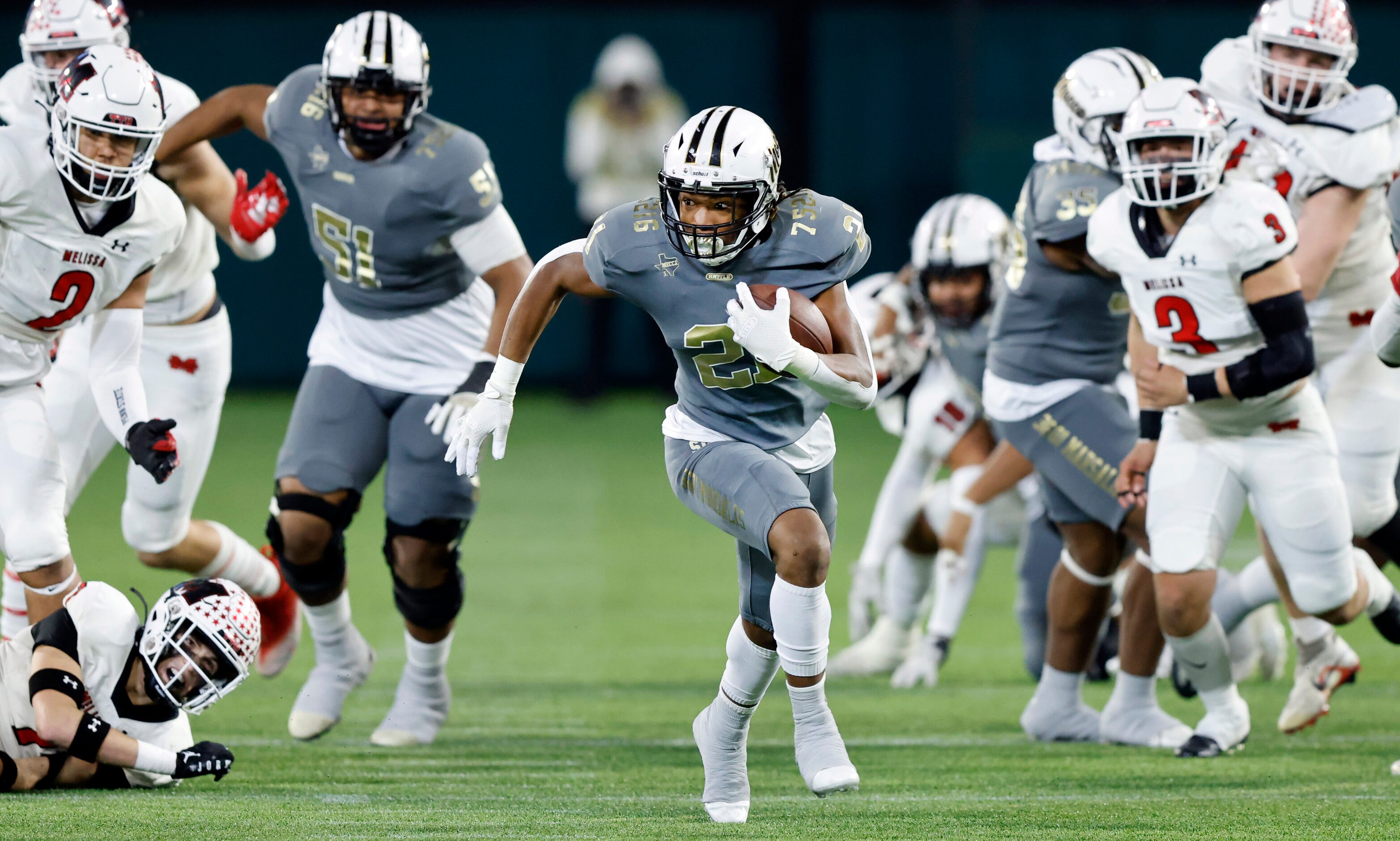 South Oak Cliff running back Danny Green (21) broke a couple Melissa tackles as he raced for...