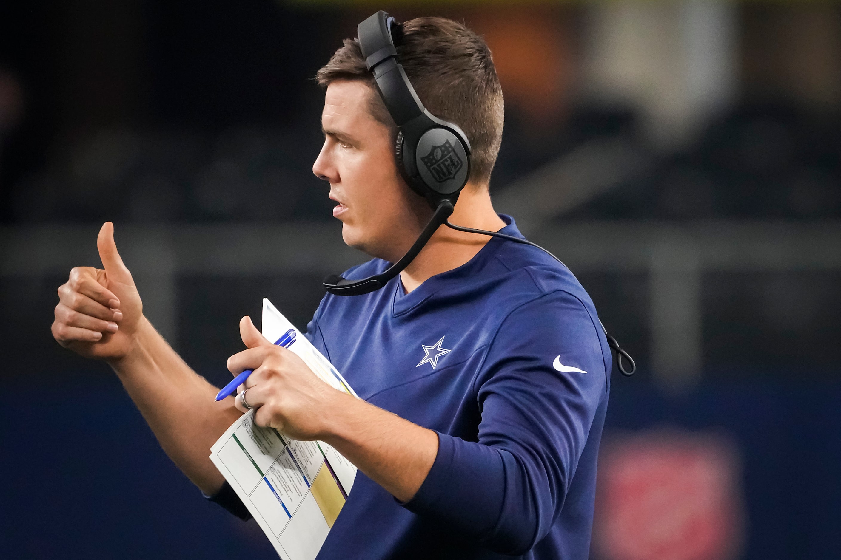 Dallas Cowboys offensive coordinator Kellen Moore gives thumbs up to quarterback Ben DiNucci...