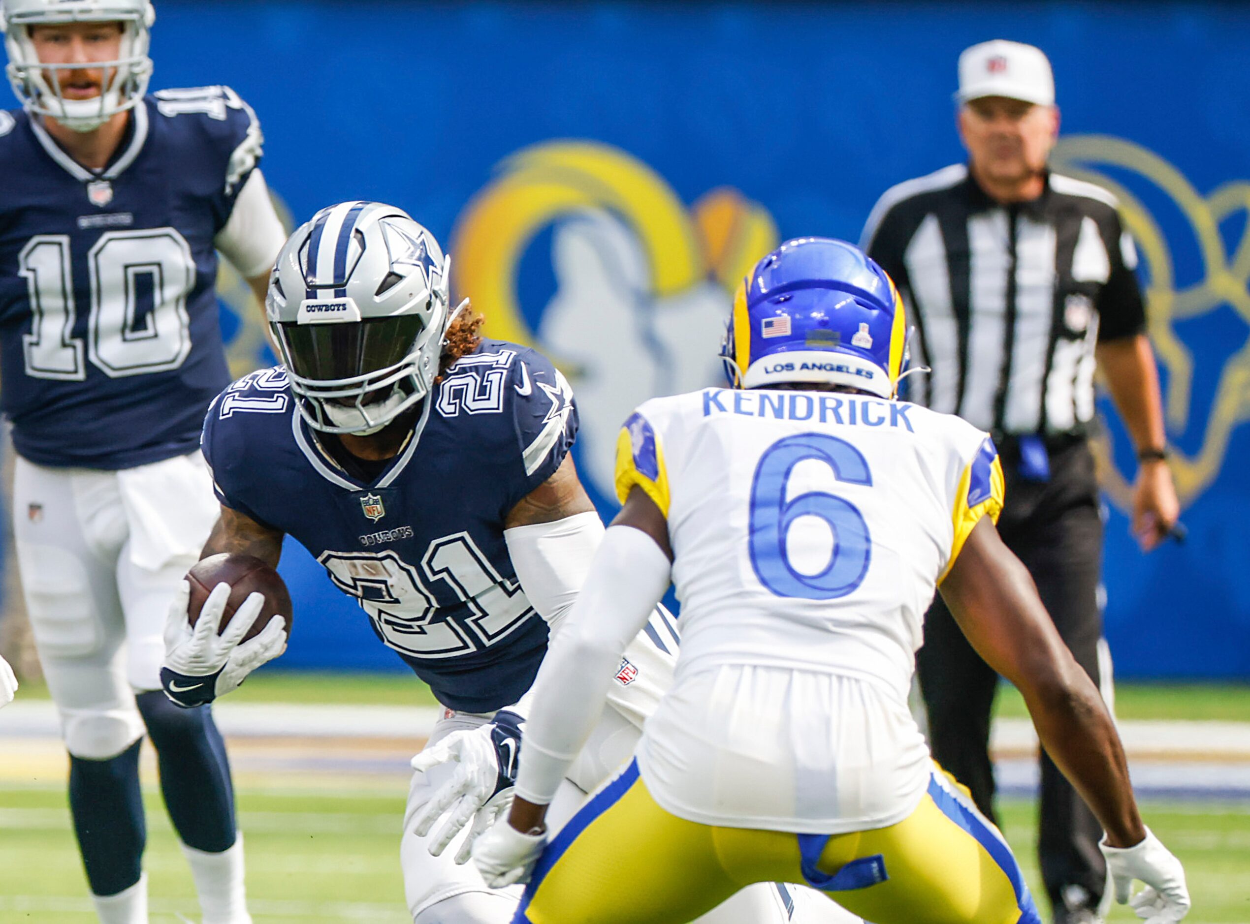 Dallas Cowboys running back Ezekiel Elliott (21) runs the ball as Los Angeles Rams...