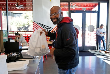 Terry Boston of Frisco was near the front of the line when Dave’s Hot Chicken opened in...