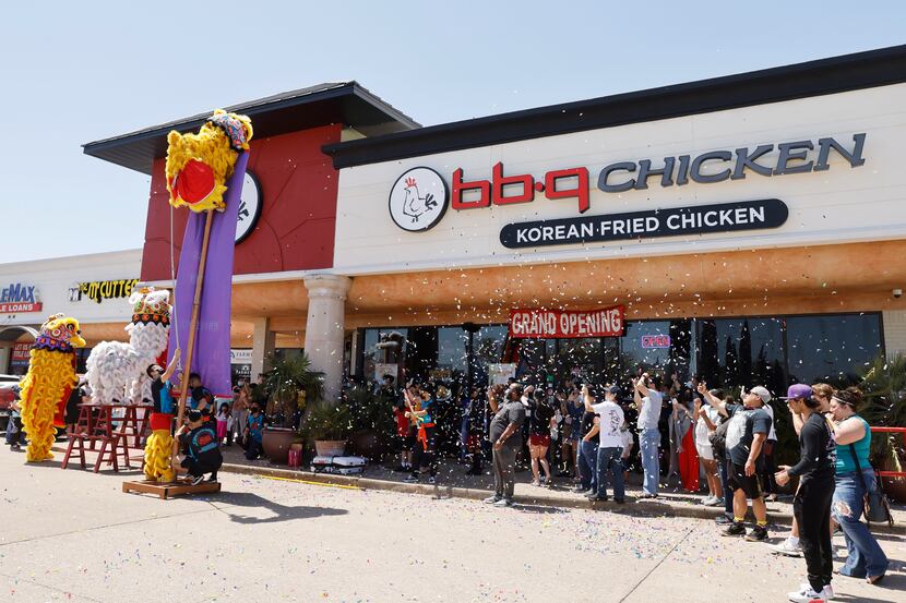 Confetti flies through the air during a grand opening event at BB.Q Chicken in Richardson.