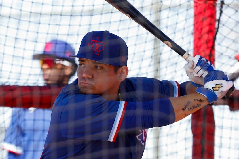 Texas Rangers minor league outfielder Alejandro Osuna takes part in a batting practice...