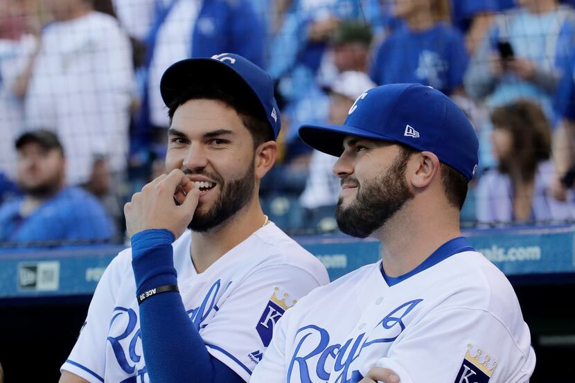 Kansas City Royals' Mike Moustakas, right, and Eric Hosmer watch a video on highlights...