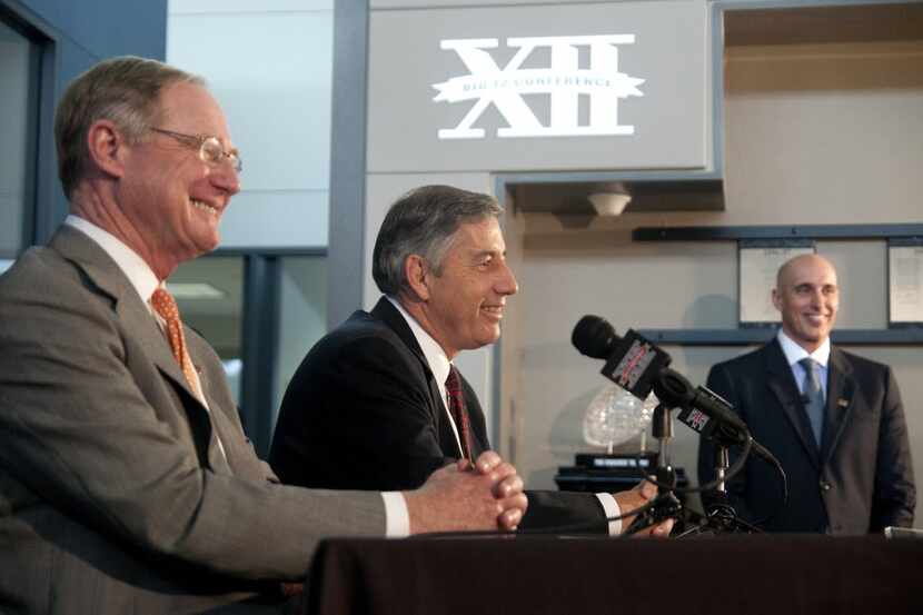Newly selected Big 12 commissioner Bob Bowlsby, center, and Big 12 Conference Board of...