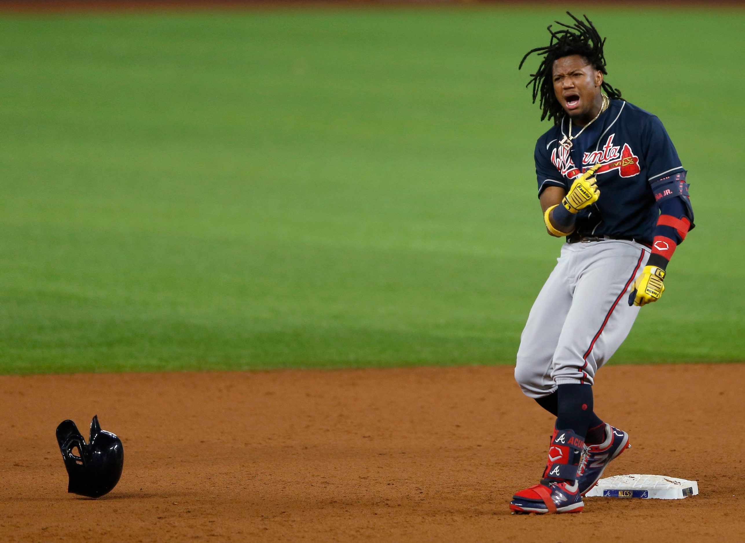 Atlanta Braves center fielder Ronald Acuna Jr. (13) celebrates after hitting a double during...