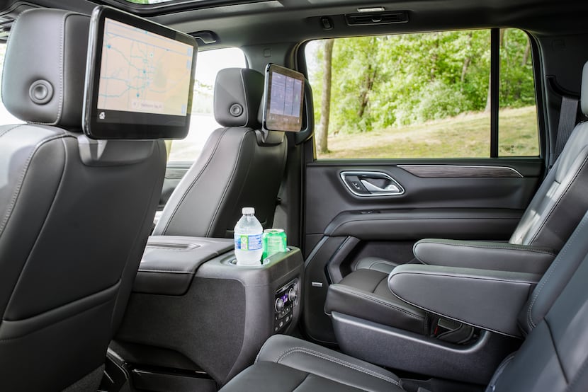 2021 Chevrolet Suburban has an optional power sliding console to bring the rear drink...