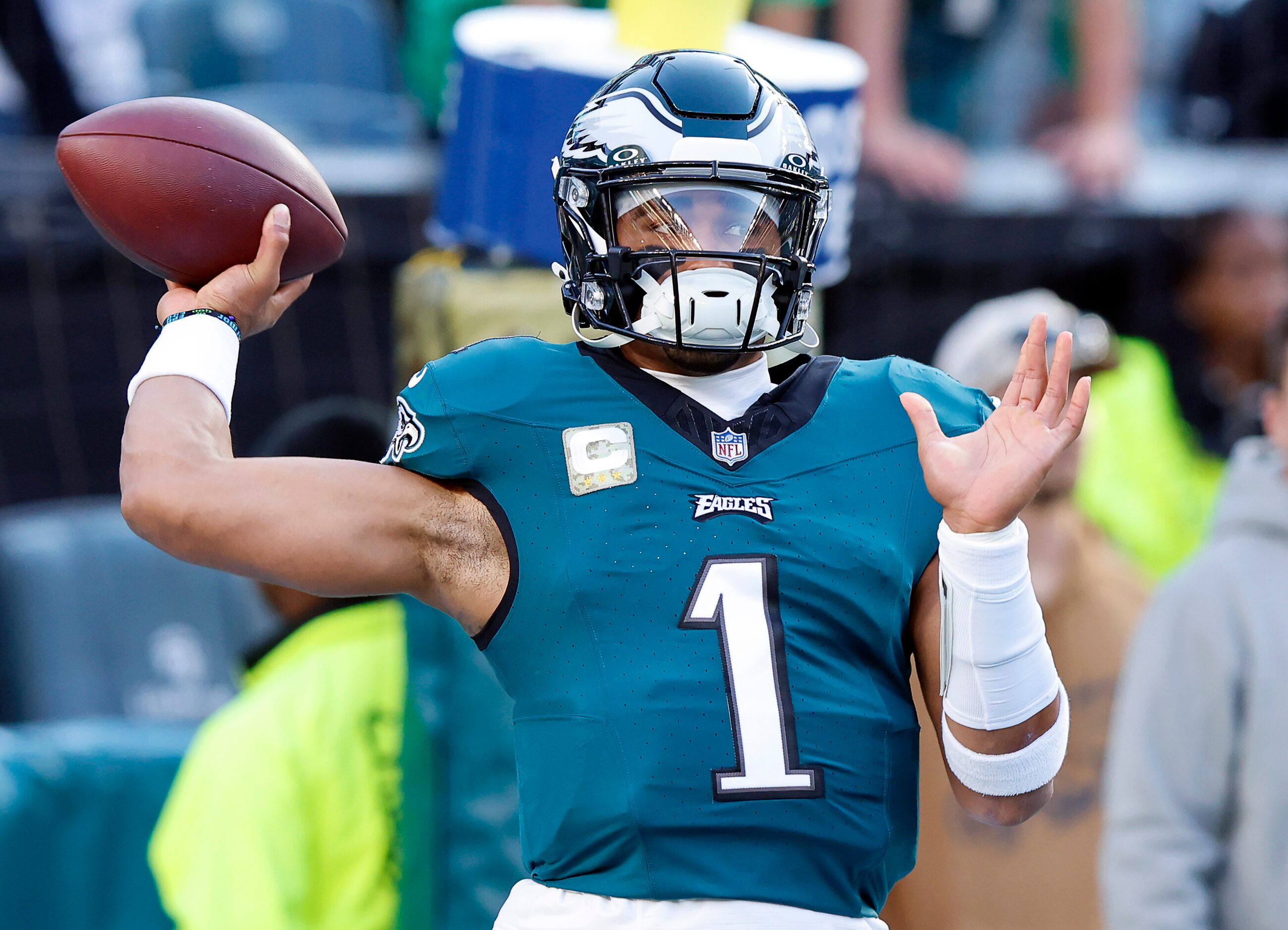 Philadelphia Eagles quarterback Jalen Hurts (1) warms up his arm as he throws before facing...