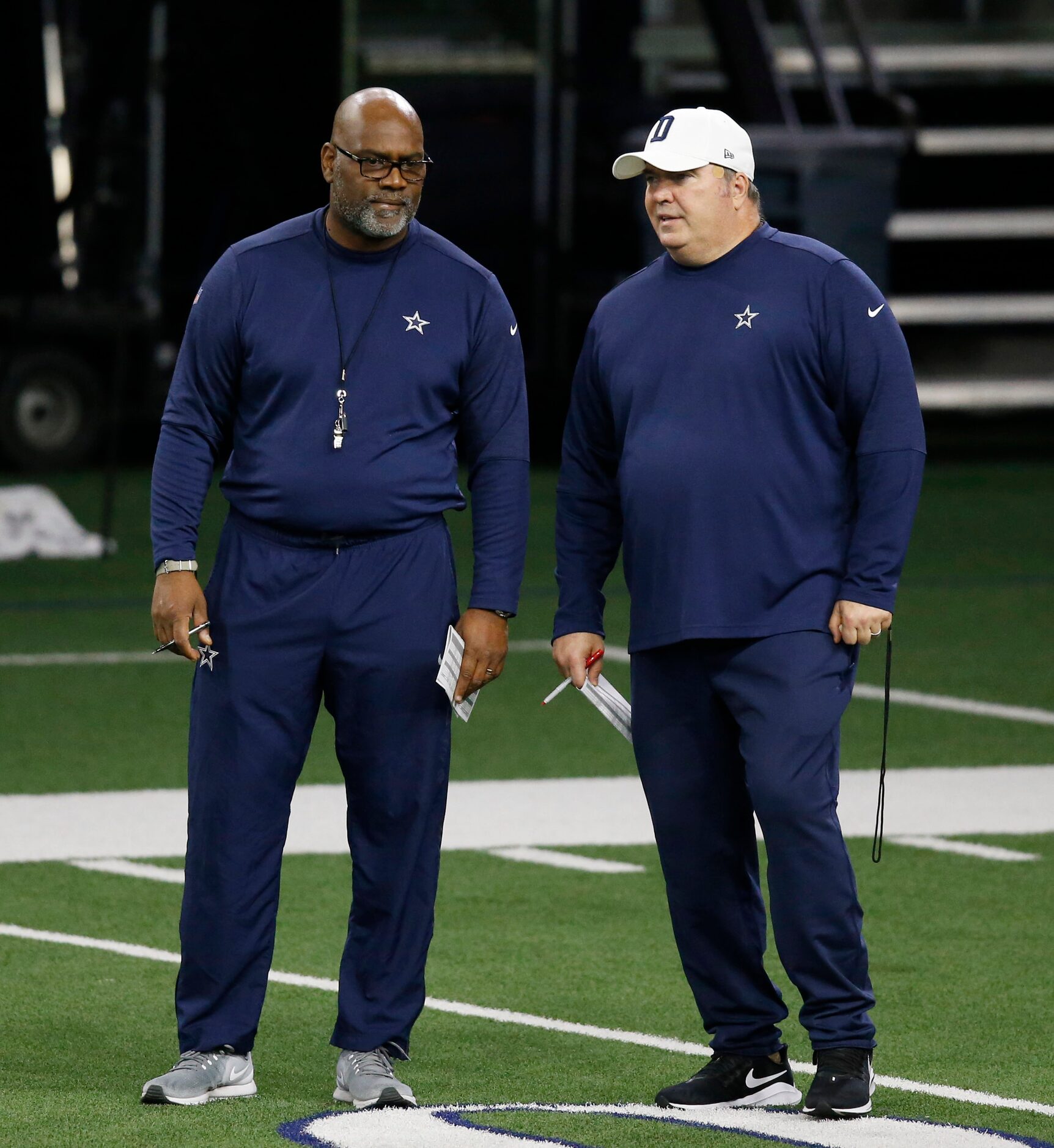 Dallas Cowboys assistant head coach Rob Davis talks with Dallas Cowboys head coach Mike...