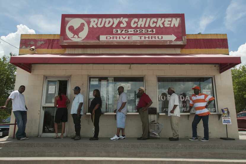 Customers line up to order from Rudy's Chicken on S. Lancaster.  It's owner Rudolph Edwards...