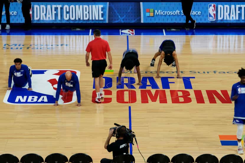 Participants warm up on the court during the 2023 NBA basketball Draft Combine in Chicago,...