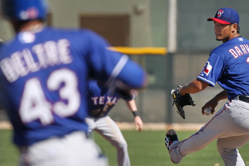Texas pitcher Yu Darvish throws a pitch during the intrasquad game  at the Texas Rangers...