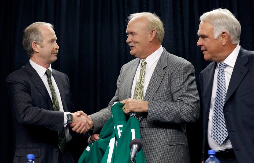 FILE - In this June 21, 2013, file photo, Dallas Stars' hockey coach Lindy Ruff, center,...
