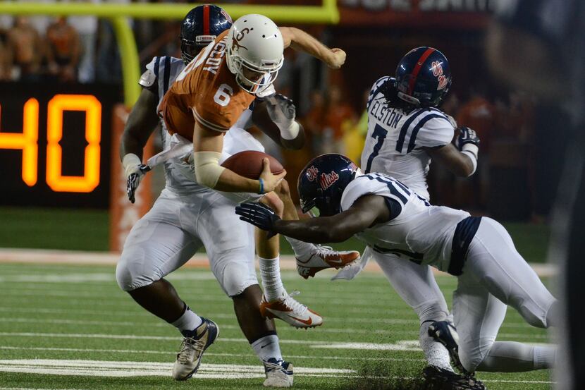Sep 14, 2013; Austin, TX, USA; Texas Longhorns quarterback Case McCoy (6) is tackled by the...