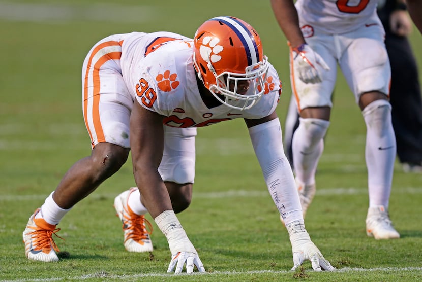 FILE - Clemson's Clelin Ferrell (99) lines up against North Carolina State during the second...