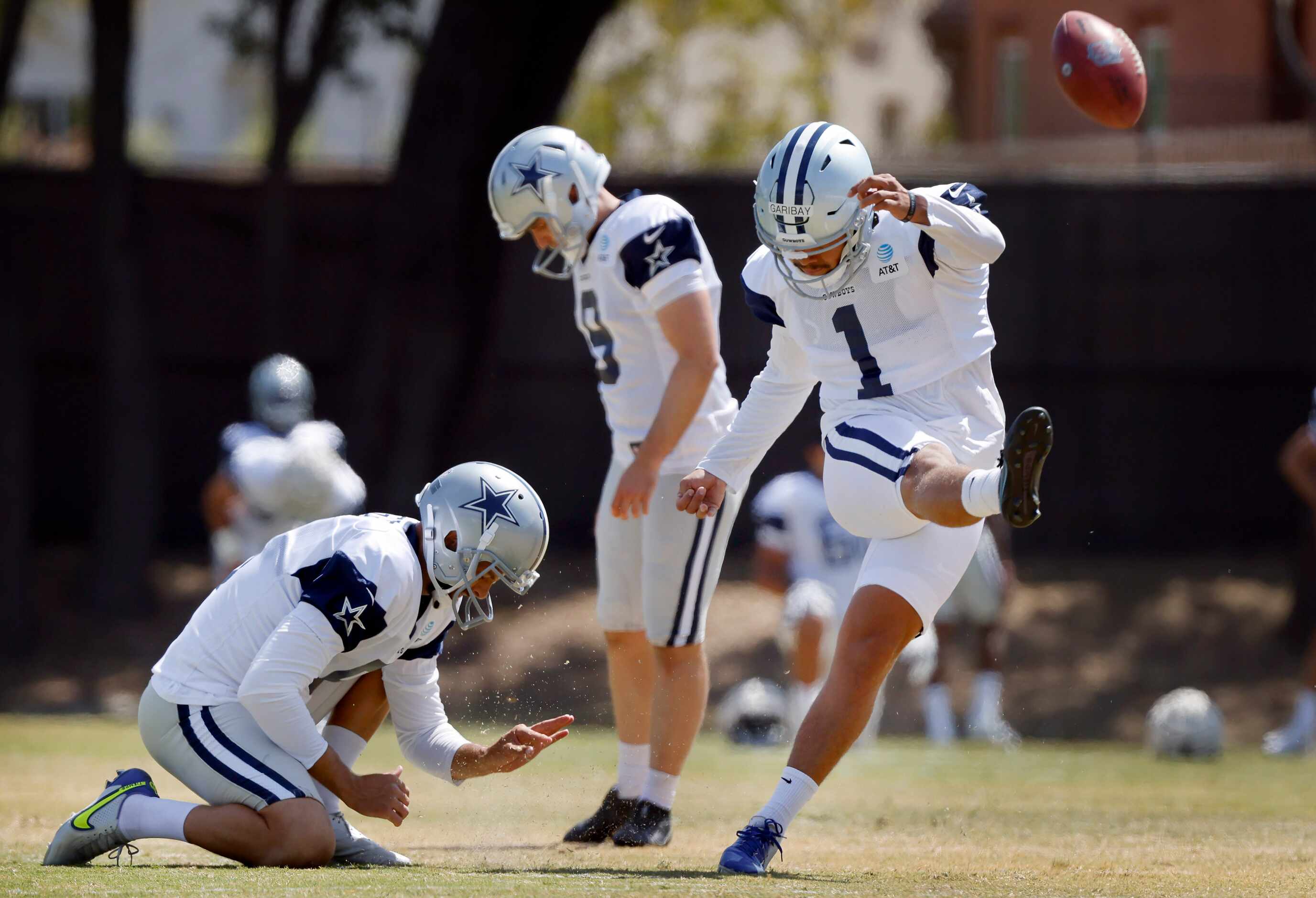 Dallas Cowboys kicker Jonathan Garibay (1) follows through on a kick during warmups at...