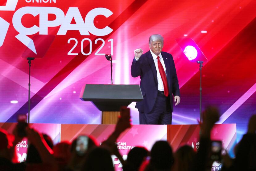 Spectators cheer wildly as former President Donald Trump finishes his speech during CPAC at...