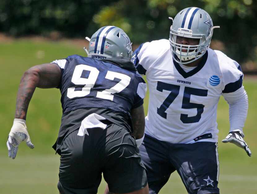 Dallas Cowboys offensive tackle Cameron Fleming (75) blocks defensive end Taco Charlton...