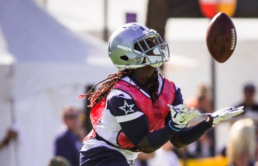 Dallas Cowboys wide receiver Lucky Whitehead returns a kick during afternoon practice at...