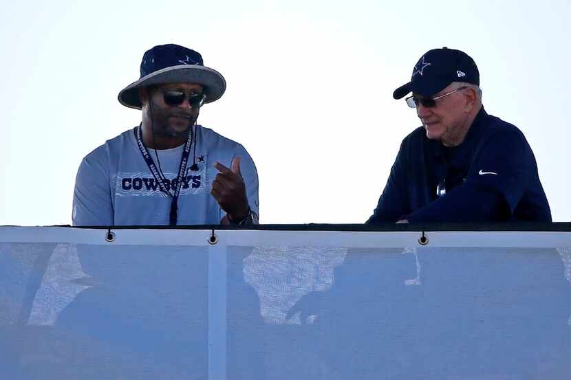Dallas Cowboys owner Jerry Jones, right, talks with Dallas Cowboys vice president for player...