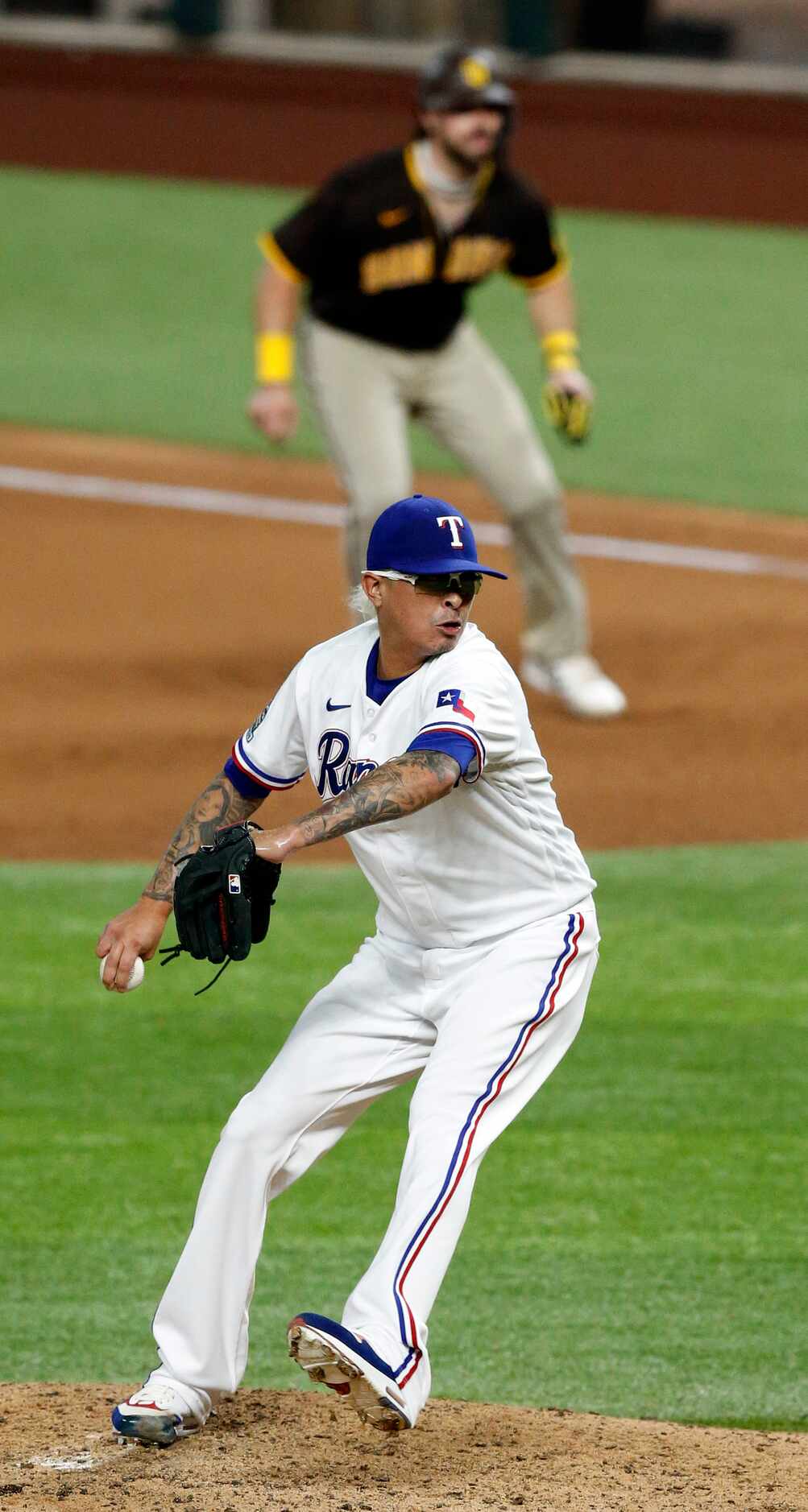 Texas Rangers relief pitcher Jesse Chavez (30) throws against the San Diego Padres during...