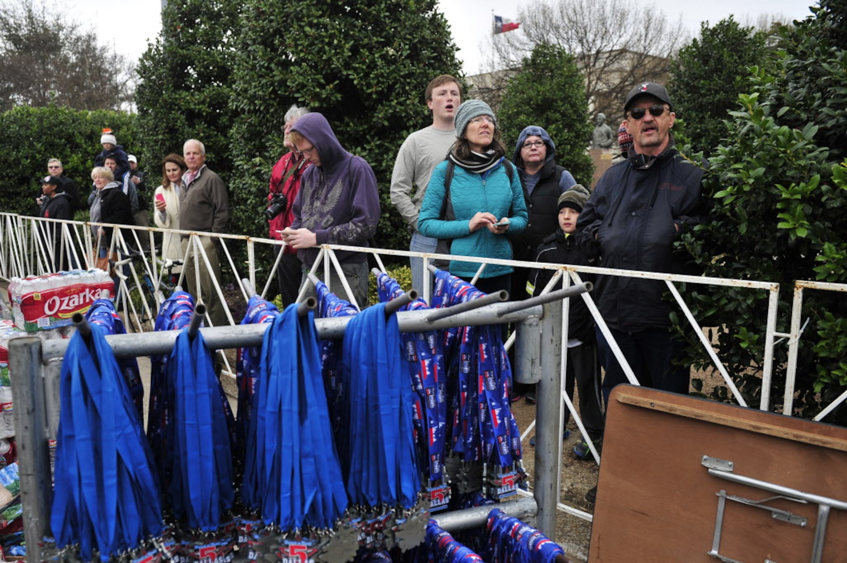 Spectators wait for friends and family to cross the finish line during the Dallas Rock N'...