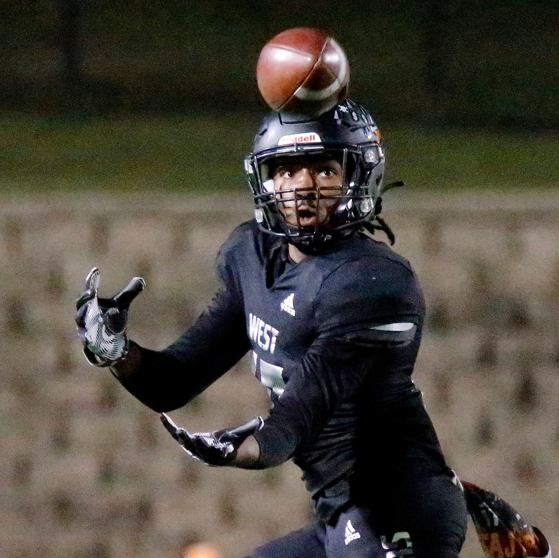 West Mesquite High School wide receiver TJ Turner (17) catches a pass and takes it to the...